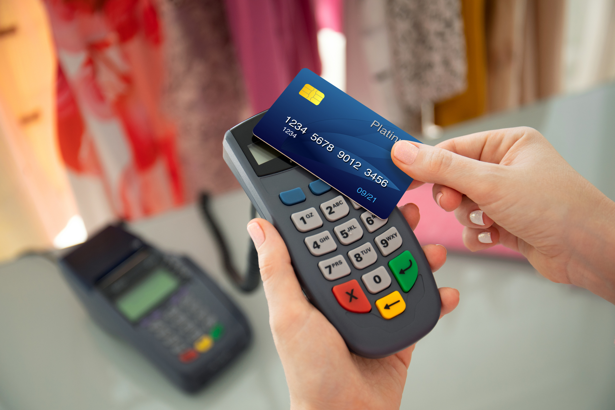 Card inserted into reader; payment processing; clothing store.